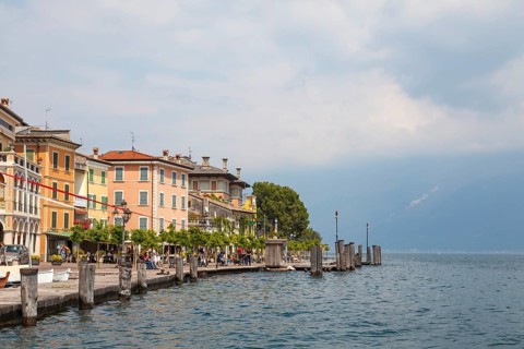 Waterfront promenade with restaurants in Gargnano, Lake Garda, Province of Brescia, Lombardy,