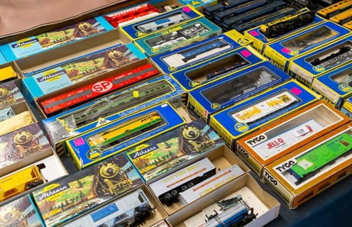 Display model train railway set boxes at auction, UK