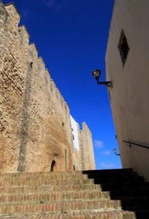 Historic street and castle walls in the village of Vejer de la Frontera, Cadiz Province, Spain,