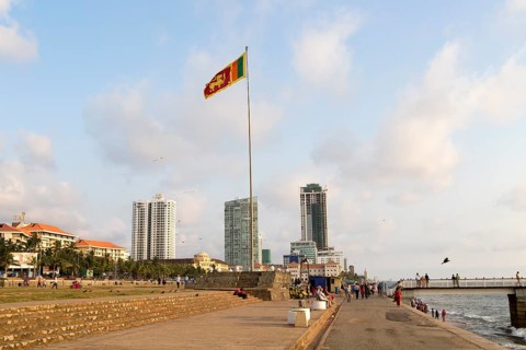 National flag and High rise buildings Galle Face Green, Colombo, Sri Lanka, Asia