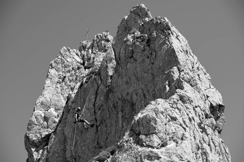 Climber abseiling on the Rosssteinnadel, mountaineering village Kreuth, Mangfall mountains,
