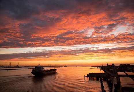 Sunset orange glow landscape clouds water, North Sea shipping, Port of Rotterdam, Hook of Holland,