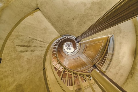 A detailed view of a spiral staircase with a spiral banister in beige tones, Schachtrupp Villa,