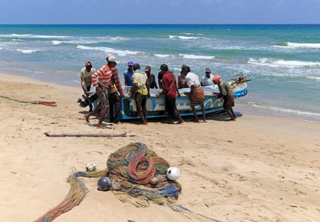 Traditional fishing hauling nets Nilavelli beach, near Trincomalee, Eastern province, Sri Lanka,