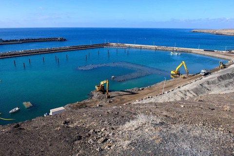 View of two excavators dredging harbour basin new marina harbour for pleasure boats yachts yachts