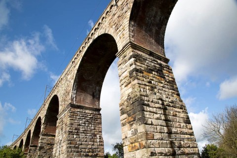 Stone arches of railway viaduct crossing River Tweed, Berwick-upon-Tweed, Northumberland, England,