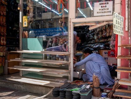 Shoe shops and craftsmen in the Al Fahidi neighbourhood, Dubai, United Arab Emirates, Asia