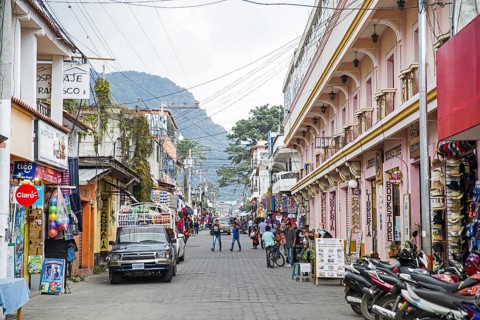 Shops and restaurants in shopping street in the town Panajachel at Lago de Atitlan, Lake Atitlan,