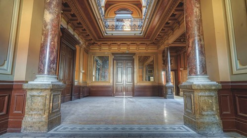 Historic interior with marble floor and painted ceilings between columns, Villa Woodstock, Lost