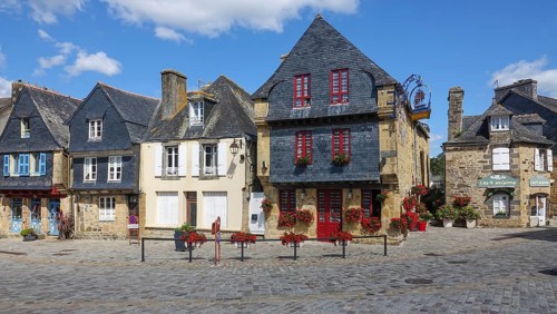 Rue du General de Gaulle in the old town centre of Le Faou with slate-roofed granite houses from