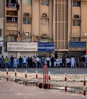 Midday prayer in front of a mosque, Al Fahidi neighbourhood, Dubai, United Arab Emirates, Asia