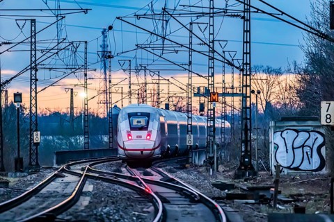 Railway line with many overhead lines and railway signals, InterCityExpress ICE of Deutsche Bahn