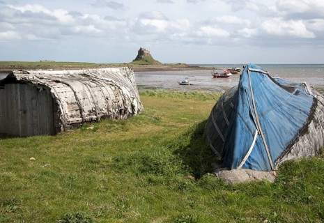 Upturned boats used as storage shed, Holy Island, Lindisfarne, Northumberland, England, UK