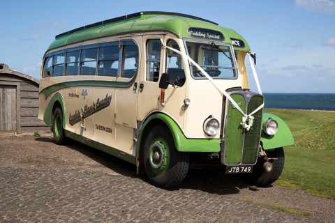 Antique motor coach seen on Holy Island, Lindisfarne, Northumberland, England, UK