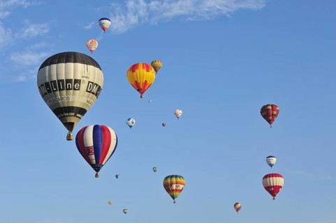 Balloonists, Aeronauts flying in hot-air balloons during ballooning meeting