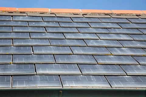 Close up of photovoltaic roof tiles on building, Kynance Cove, Cornwall, England, UK