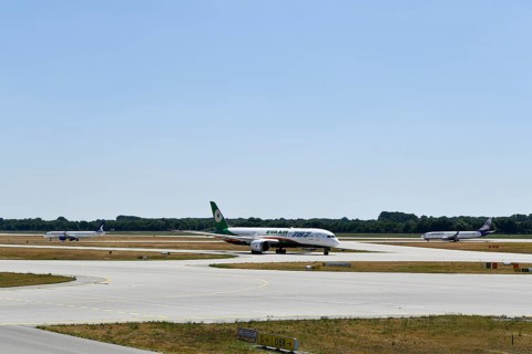 Eva Air Dreamliner, SunExpress and Anadolujet Airlines aircraft taxiing on the taxiways at Runway