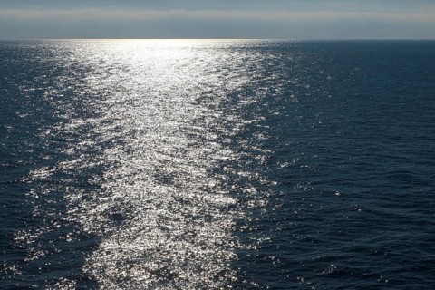Sunlight at dusk on calm water of the Mediterranean Sea