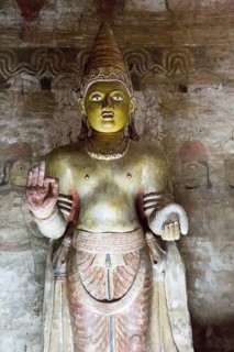 Buddha figure inside Dambulla cave Buddhist temple complex, Sri Lanka, Asia