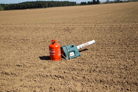 Scatterer gas canister bird scarer on farmland, Sutton, Suffolk, England, UK