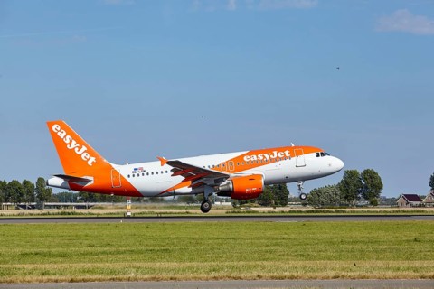 EasyJet Airbus A319-111 with registration OE-LQM lands on the Polderbaan, Amsterdam Schiphol