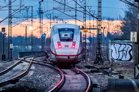 Railway line with many overhead lines and railway signals, InterCityExpress ICE of Deutsche Bahn