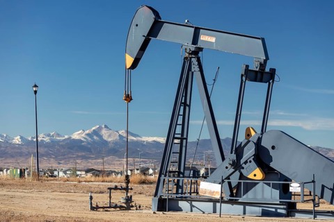 Frederick, Colorado, An oil well near a housing subdivision on Colorado's front range, with Mount
