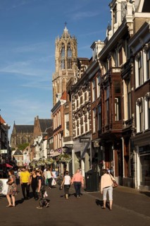 Historic buildings and famous fourteenth century Dom church tower in city of Utrecht, Netherlands