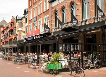 People sitting at street cafes, Eindhoven city centre, North Brabant province, Netherlands