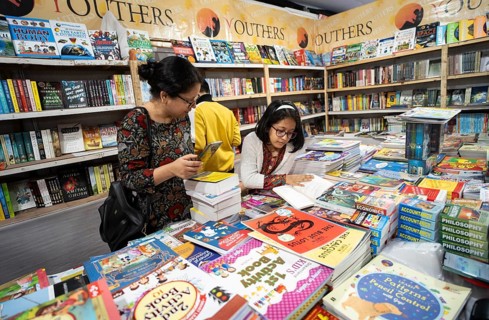Book readers browsing books at a stall during Assam Book Fair, in Guwahati, Assam, India on 29