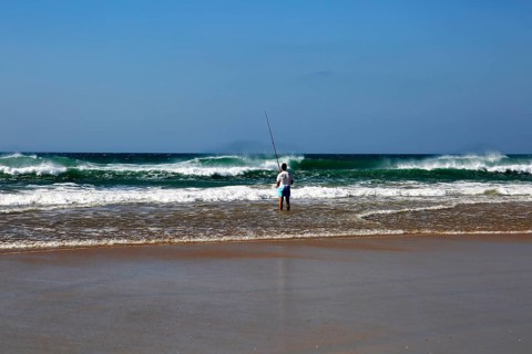 Man fishing from the beach at Conil de la Frontera, Cadiz province, Spain, Europe