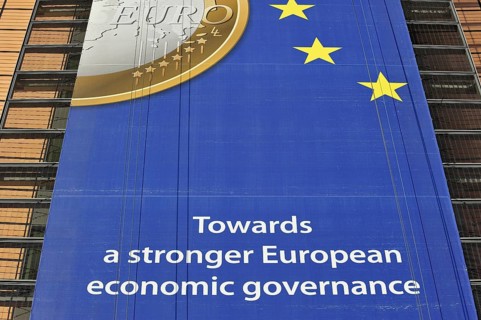 Banner about the euro hanging from the Berlaymont building of the European Commission, executive