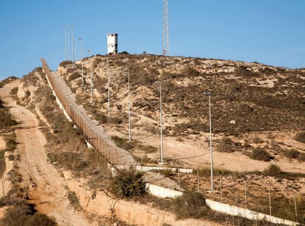 Security fence and look-out tower of military base in Melilla autonomous city state Spanish