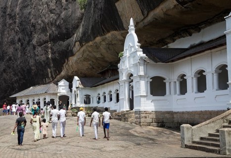 People at Dambulla cave Buddhist temple complex, Sri Lanka, Asia