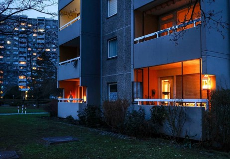 Illuminated balconies on a tower block in Gropiusstadt. The rise in rents in German cities