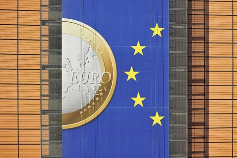 Banner about the euro hanging from the Berlaymont building of the European Commission, executive