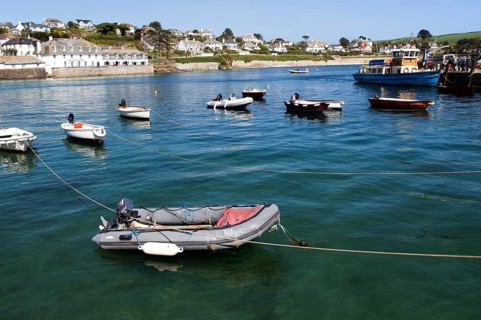 Ferry boat and dinghies in the harbour, St Mawes, Cornwall, England, UK