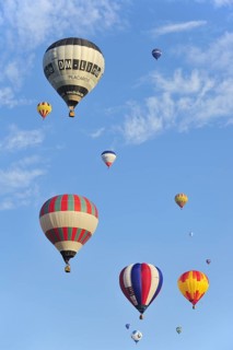 Balloonists, Aeronauts flying in hot-air balloons during ballooning meeting