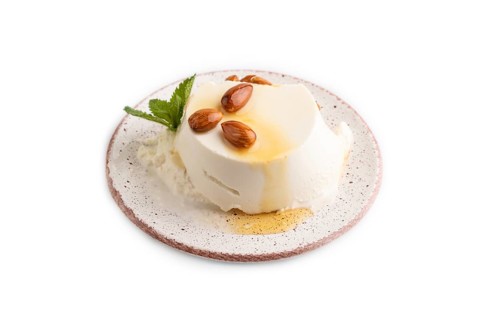 Ricotta cheese with honey and almonds isolated on white background. side view, close up