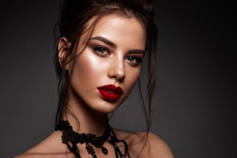 Gorgeous Young Brunette Woman face portrait. Beauty Model Girl with bright eyebrows, perfect