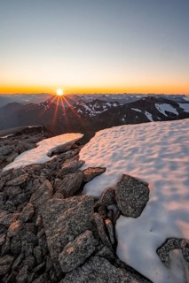 View of mountain panorama, sun star at sunset, summit of Skala, Loen, Norway, Europe