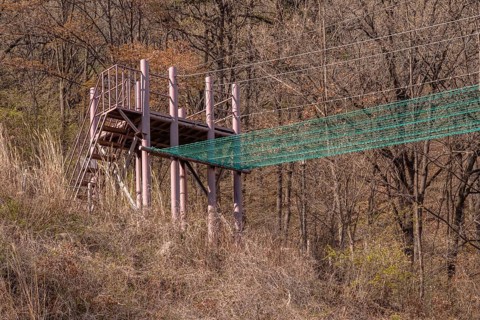Fire brigade training tower and attached safety net used to practice balance located in