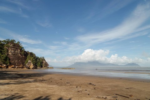 Cliff in Bako national park, sunny day, blue sky and sea. Vacation, travel, tropics concept, no