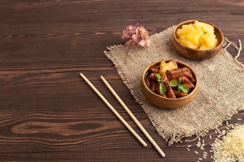 Tteokbokki or Topokki, fried rice cake stick, popular Korean street food with spicy jjajang sauce