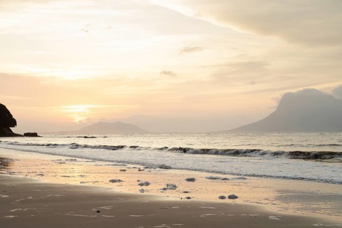 Bako national park, sea sandy beach, overcast, cloudy sunset, sky and sea, low tide. Vacation,