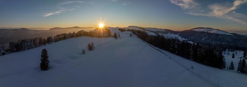Sunset over the second Jura chain in winter, foreground contours of sinkholes, view towards the