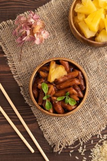 Tteokbokki or Topokki, fried rice cake stick, popular Korean street food with spicy jjajang sauce