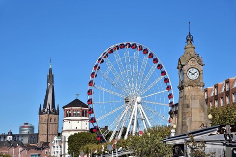 View over the Rhine terrace of Duesseldorf with the church tower of Sankt Lambertus, the castle