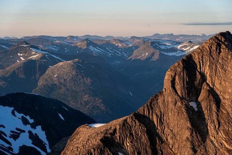 Mountain peak in soft evening light, view from the summit of Skala at sunset, Loen, Norway, Europe