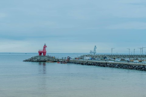 Lighthouses built to look like horses on concrete prier in Jeju, South Korea, Asia